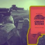 A person checks their credit score on a tablet while considering bad credit financing for ATV parked on a trail