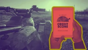 A person checks their credit score on a tablet while considering bad credit financing for ATV parked on a trail