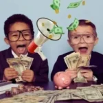 Two excited young boys in business suits sit at a desk covered in cash, illustrating the fun of learning how to make money as a kid